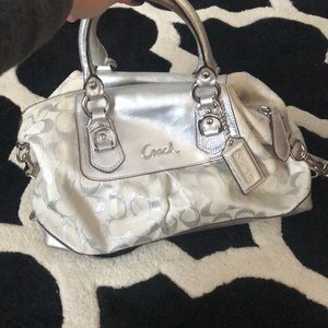 Silver and white coach purse